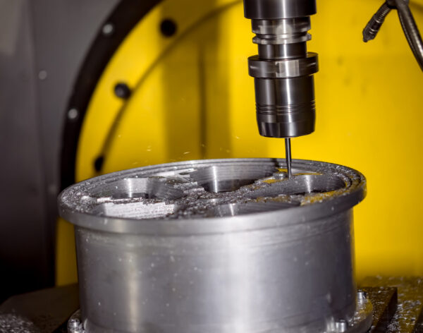 Metalworking CNC milling machine. Cutting metal modern processing technology. Small depth of field. Warning - authentic shooting in challenging conditions. A little bit grain and maybe blurred.